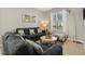 Comfortable living room featuring tile floors, neutral paint, and lots of natural light at 620 Orange Cosmos Blvd, Davenport, FL 33837