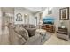 Comfortable living room featuring tile floors, neutral paint, and television at 620 Orange Cosmos Blvd, Davenport, FL 33837