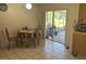 Casual dining area with sliding glass door to outdoor screened patio at 6743 Sw 129Th St, Ocala, FL 34473