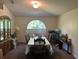 Bright dining room with an arched window and neutral paint at 6743 Sw 129Th St, Ocala, FL 34473