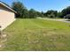 Expansive side yard with lush green grass and ample space at 6743 Sw 129Th St, Ocala, FL 34473