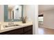 Bathroom vanity with a decorative mirror, and neutral countertops at 690 Shady Ct, Altamonte Springs, FL 32701