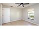 Bedroom with tile flooring, ceiling fan and one window, and a standard white closet door at 690 Shady Ct, Altamonte Springs, FL 32701