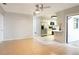 Bright living room featuring neutral paint, tile flooring and a partial view of the updated kitchen at 690 Shady Ct, Altamonte Springs, FL 32701