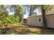 Backyard shed surrounded by trees at 690 Shady Ct, Altamonte Springs, FL 32701