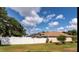 Spacious backyard enclosed by a white vinyl fence, offering privacy and ample space for outdoor activities at 730 Garberia Dr, Davenport, FL 33837