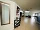 Inviting entryway with elegant tile flooring, decorative mirror, and console table, leading into the open-concept living area at 730 Garberia Dr, Davenport, FL 33837