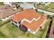 Aerial view of home showing tile roof, manicured lawn, and outdoor living spaces at 890 Spinnaker Way, Kissimmee, FL 34746