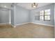 Inviting dining room with neutral tones, tile flooring, and a large window providing natural light at 890 Spinnaker Way, Kissimmee, FL 34746