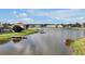 Picturesque lake view featuring a private dock, perfect for enjoying waterfront living at 890 Spinnaker Way, Kissimmee, FL 34746