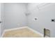 Laundry room featuring a tile floor, base trim and a wire rack at 890 Spinnaker Way, Kissimmee, FL 34746