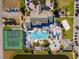 Stunning aerial view of the community pool, tennis courts, and playground at 8900 Candy Palm Rd, Kissimmee, FL 34747