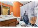 Train-themed bathroom features a themed shower curtain and vanity with ample counter space at 8900 Candy Palm Rd, Kissimmee, FL 34747