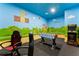 Fun game room with Super Mario Brothers themed walls, foosball table, and Street Fighter II arcade at 8900 Candy Palm Rd, Kissimmee, FL 34747