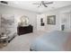 Inviting bedroom features a dark wood dresser, a decorative mirror, and neutral decor at 9280 Sea Pine Ave, Orlando, FL 32832