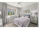 Charming bedroom with a large window, cozy bed, neutral tones and stylish decor at 9292 Sea Pine Ave, Orlando, FL 32832