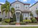 Charming two-story home featuring tidy landscaping, a covered front entry, and a symmetrical design at 9918 Pallida Hickory Way, Winter Garden, FL 34787