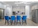 Kitchen featuring stainless steel appliances, a center island with seating, and generous counter space at 9918 Pallida Hickory Way, Winter Garden, FL 34787