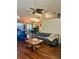 Inviting living room boasts with wood floors and neutral walls at 1011 Piedmont Oaks Dr, Apopka, FL 32703