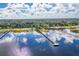 Aerial view of a lake with walking docks for leisure walks and enjoyment at 105 Lena Ann Dr, St Cloud, FL 34771