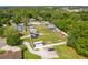 Aerial view of a recreational vehicle and boat storage lot surrounded by trees and residential properties at 105 Lena Ann Dr, St Cloud, FL 34771