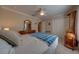 Bedroom features a bed, ceiling fan, and dresser at 105 Lena Ann Dr, St Cloud, FL 34771