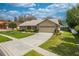 Well-maintained home with a verdant front lawn, mature shrubbery, and a convenient two-car garage at 105 Lena Ann Dr, St Cloud, FL 34771