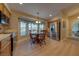 Cozy kitchen featuring a stainless steel refrigerator and light wood cabinetry with a breakfast nook area at 105 Lena Ann Dr, St Cloud, FL 34771