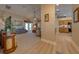 Open concept living area flows into the kitchen, featuring modern flooring and neutral decor at 105 Lena Ann Dr, St Cloud, FL 34771