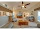 Spacious living room with vaulted ceiling, view to kitchen, and comfortable seating area at 105 Lena Ann Dr, St Cloud, FL 34771