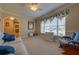 Comfortable living room featuring natural light, neutral colors, and cozy furniture at 105 Lena Ann Dr, St Cloud, FL 34771
