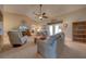 Bright living room featuring vaulted ceilings, comfortable furnishings, and access to the outdoors at 105 Lena Ann Dr, St Cloud, FL 34771