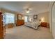 Spacious main bedroom with large windows, ample closet space, and a ceiling fan at 105 Lena Ann Dr, St Cloud, FL 34771