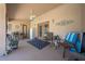 Enclosed patio area with seating, fan, decor, and access to the pool at 105 Lena Ann Dr, St Cloud, FL 34771