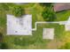 Top-down view of playground and sports area surrounded by grass and trees at 105 Lena Ann Dr, St Cloud, FL 34771