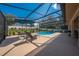 Relaxing screened-in pool with outdoor seating in a well-maintained backyard at 105 Lena Ann Dr, St Cloud, FL 34771
