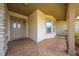 Welcoming porch with neutral colors and a tiled floor, leading to a double-door entrance at 105 Lena Ann Dr, St Cloud, FL 34771