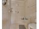 Tiled walk-in shower featuring a built-in seat and handheld shower head at 105 Lena Ann Dr, St Cloud, FL 34771