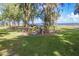 A lakeside pier surrounded by trees, inviting exploration and nature observation at 105 Lena Ann Dr, St Cloud, FL 34771