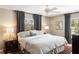 Serene primary bedroom with plush bedding, elegant nightstands, and soft lighting at 11 Stone Gate S, Longwood, FL 32779