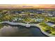 Community with a recreational pool, clubhouse, and landscaping around a scenic lake at 1507 Carey Palm Cir, Kissimmee, FL 34747
