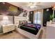 Star Wars themed bedroom features a sleek bed, Storm Trooper mural, and accent lighting for a futuristic feel at 1507 Carey Palm Cir, Kissimmee, FL 34747