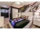 Star Wars themed bedroom features a sleek bed, Storm Trooper mural, and accent lighting for a futuristic feel at 1507 Carey Palm Cir, Kissimmee, FL 34747
