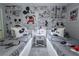 Charming bedroom features twin beds adorned with Mickey Mouse bedding and wallpaper with vintage comic strip design at 1507 Carey Palm Cir, Kissimmee, FL 34747