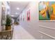 Hallway with tile flooring, Disney artwork, and stylish decor at 1507 Carey Palm Cir, Kissimmee, FL 34747