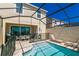 Backyard with an enclosed pool, patio with dining table and grill, and lounge chairs at 1507 Carey Palm Cir, Kissimmee, FL 34747
