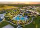 Aerial view of a stunning resort-style pool with palm trees and various amenities at 1507 Carey Palm Cir, Kissimmee, FL 34747
