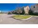 View of a street featuring new townhomes, sidewalks, streetlights and green spaces at 1507 Carey Palm Cir, Kissimmee, FL 34747