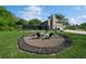 Inviting backyard with a stone fire pit, seating, and well-maintained lawn, perfect for outdoor gatherings at 1606 Wildcat Ct, Winter Springs, FL 32708