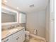 Bathroom with modern sink and marble countertop, tiled flooring, and white cabinets at 1606 Wildcat Ct, Winter Springs, FL 32708